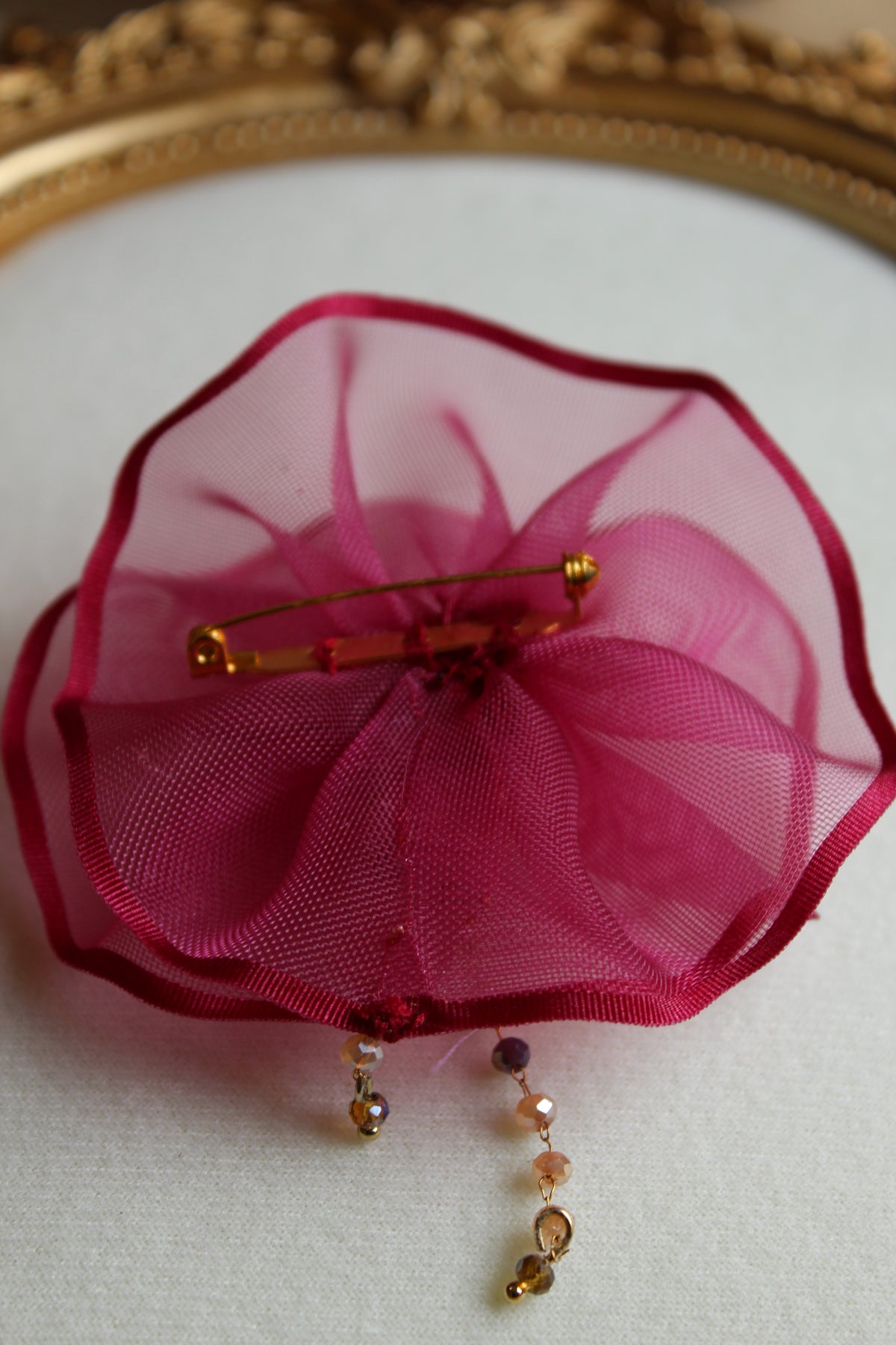 Carol brooch in magenta